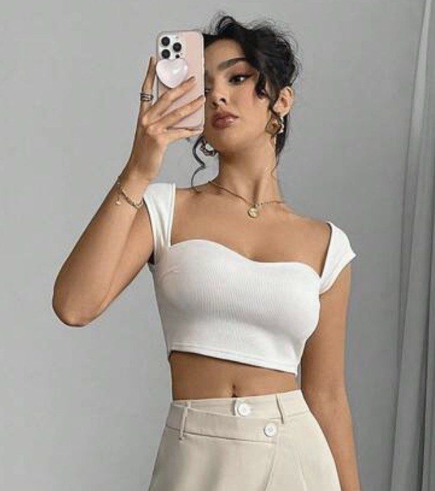 SHEIN White Ribbed Crop Top Size (Category: Sleeveless) located in Manila. Submitted by perwinkle.ph (Listing ID 1470717395, Image 2). Description: - Material: Soft, stretchy ribbed fabric - Design: eSweetheart neckline with cap sleeves .