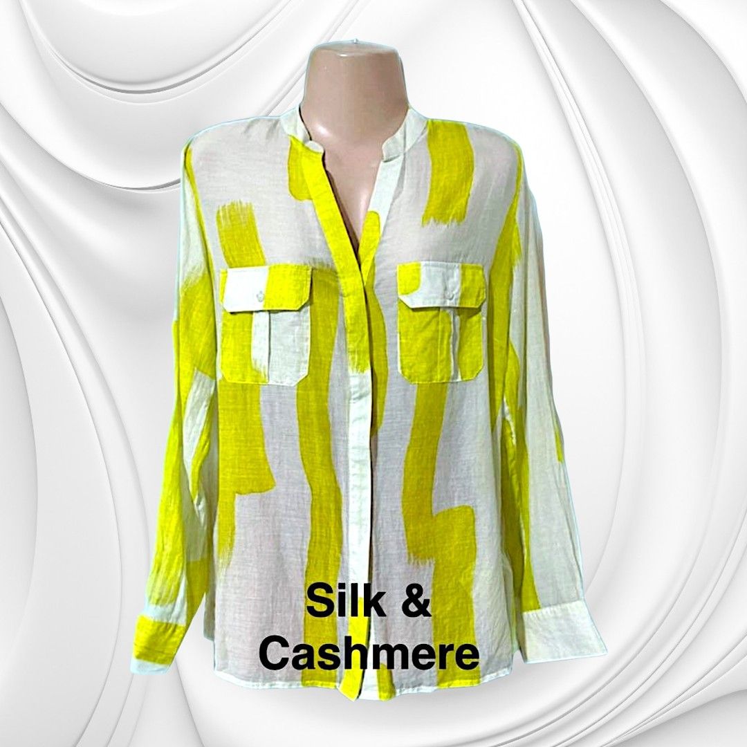 Silk & Cashmere Yellow Brushstroke Print Button-Up Blouse (Category: Blouses) located in Paranaque City. Submitted by calm_youngstore7 (Listing ID 1470649558, Image 1). Description: 70% OFF RETAIL! LAST PIECE SALE! - Brand: Silk and Cashmere - Design: White base with a bright yellow all-over brushstroke pattern - Neckline: Chic collarless V-neck - Pockets: Dual chest pockets with button flaps - Sleeves: Convertible tab sleeves (can be rolled up a