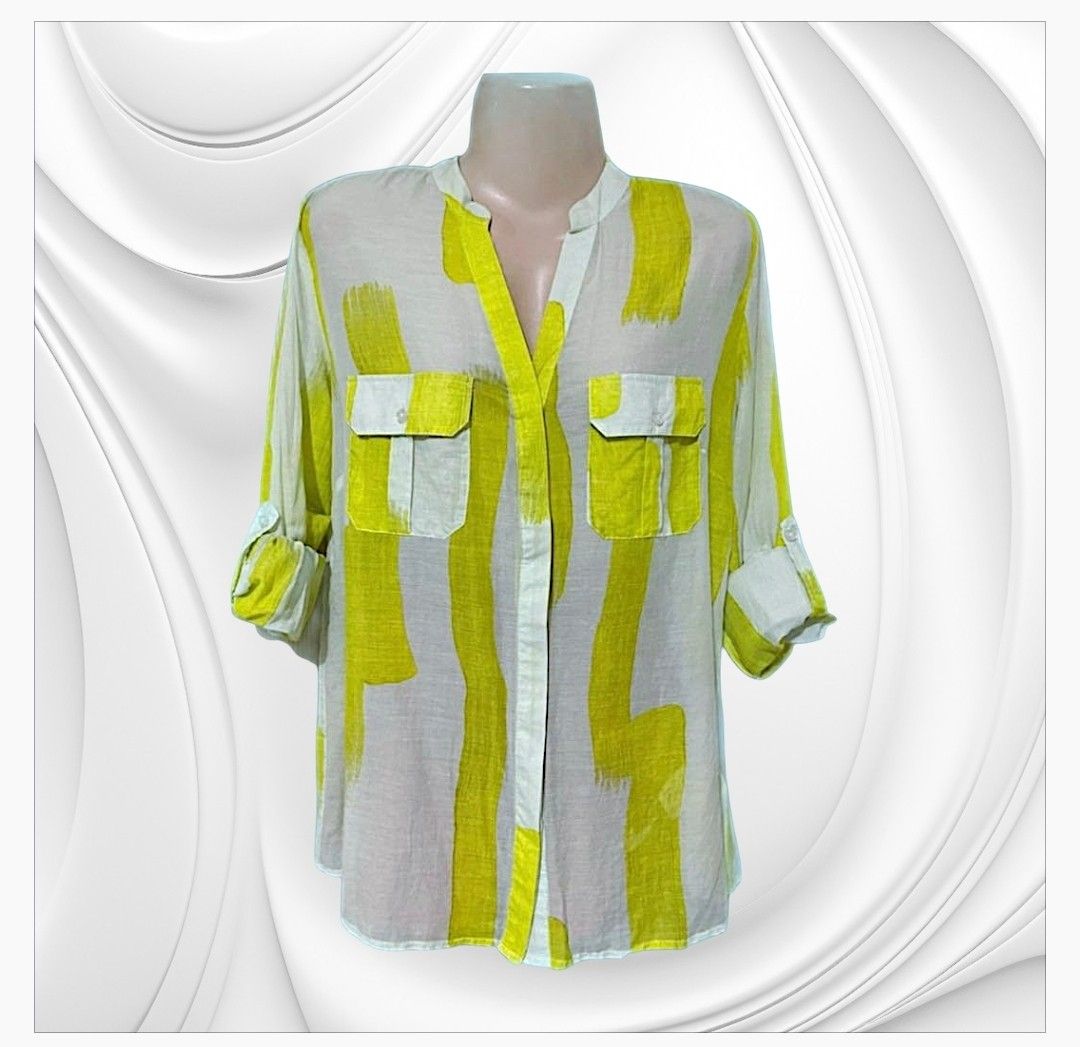 Silk & Cashmere Yellow Brushstroke Print Button-Up Blouse (Category: Blouses) located in Paranaque City. Submitted by calm_youngstore7 (Listing ID 1470649558, Image 2). Description: 70% OFF RETAIL! LAST PIECE SALE! - Brand: Silk and Cashmere - Design: White base with a bright yellow all-over brushstroke pattern - Neckline: Chic collarless V-neck - Pockets: Dual chest pockets with button flaps - Sleeves: Convertible tab sleeves (can be rolled up a