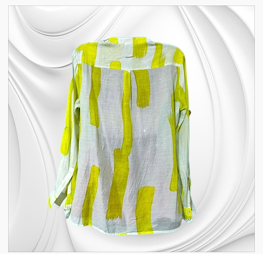 Silk & Cashmere Yellow Brushstroke Print Button-Up Blouse (Category: Blouses) located in Paranaque City. Submitted by calm_youngstore7 (Listing ID 1470649558, Image 3). Description: 70% OFF RETAIL! LAST PIECE SALE! - Brand: Silk and Cashmere - Design: White base with a bright yellow all-over brushstroke pattern - Neckline: Chic collarless V-neck - Pockets: Dual chest pockets with button flaps - Sleeves: Convertible tab sleeves (can be rolled up a
