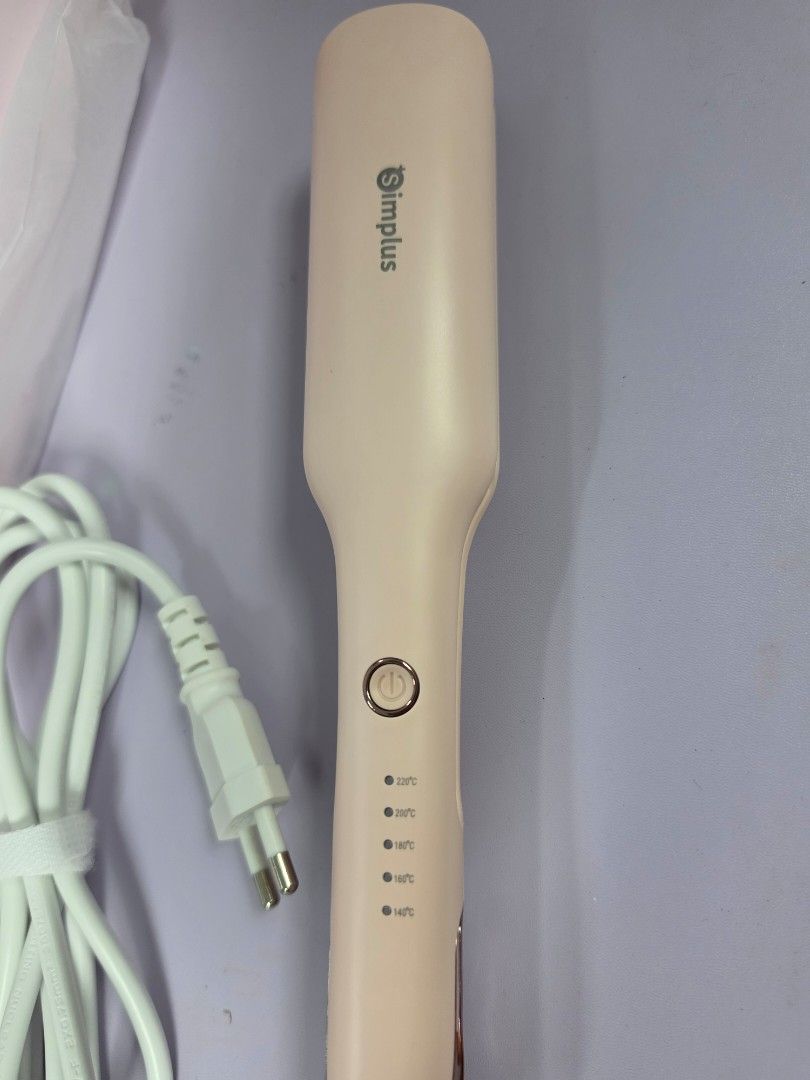 Simplus Pink Hair Curler Styling Iron (Category: Hair) located in Mandaluyong City. Submitted by Llyssa12 (Listing ID 1470603631, Image 3). Description: - Brand: Simplus pink hair curler - Condition: Brand new, never used, straight out of the original box - Heat Settings: 5 temperature levels up to 220°C - Safety: Front anti-scald design to protect fingers - Convenience: 360-degree rotating power cord and closing lock for easy storage - Best for 