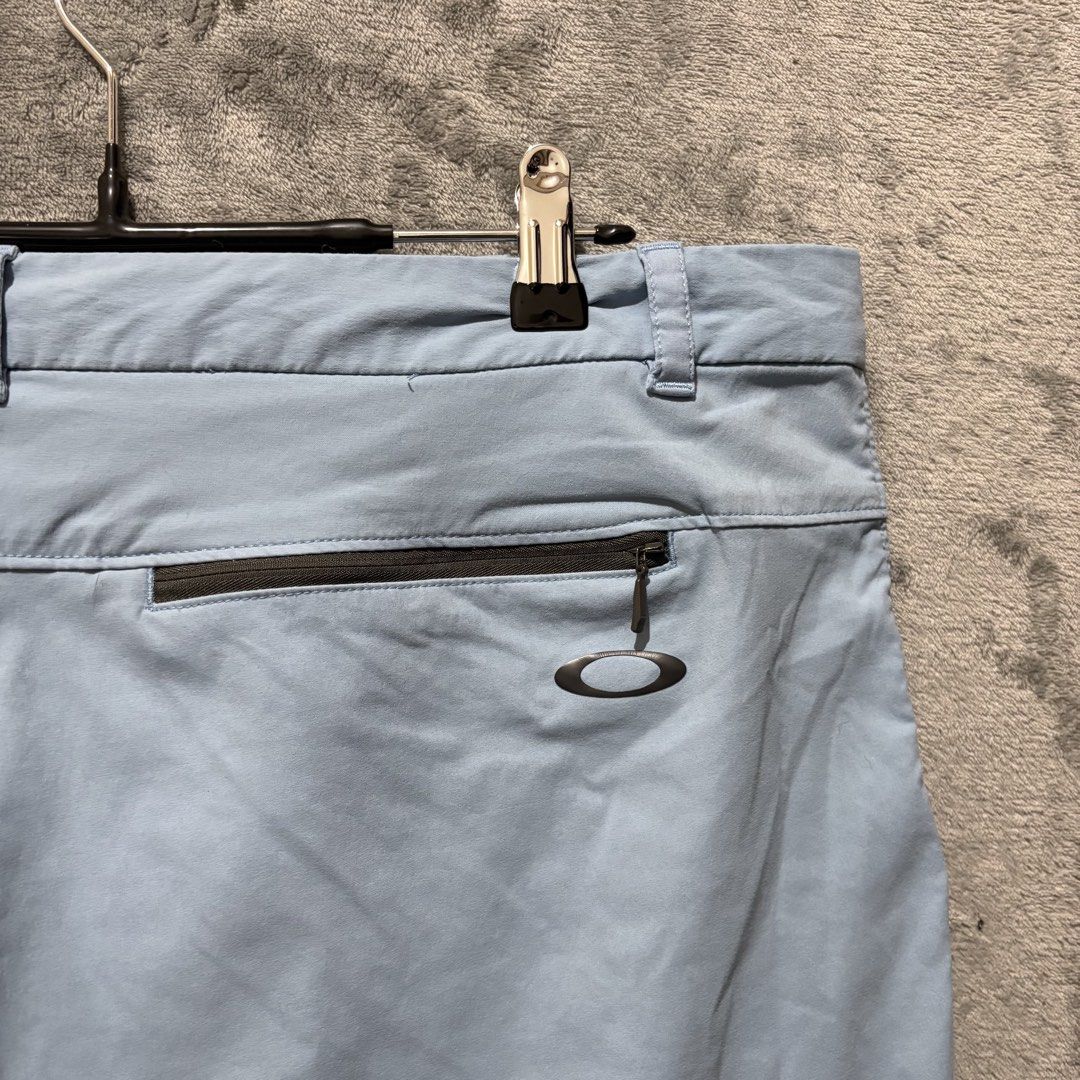 Size 38 - Oakley Regular Fit Active Cargo Golf Shorts Light Blue (Category: Shorts) located in Tuguegarao City. Submitted by past10 (Listing ID 1470714117, Image 2). Description: Authentic Oakley Regular Fit Technical Active Shorts • Size: Tagged US/EU 38 (JPN 40 — Regular straight fit) • Color: Light Blue / Pastel Sky Blue • Condition: 9/10 • Fabric is crisp and clean with no stains, rips, or color bleeding. • Rear zippered security pocket opera