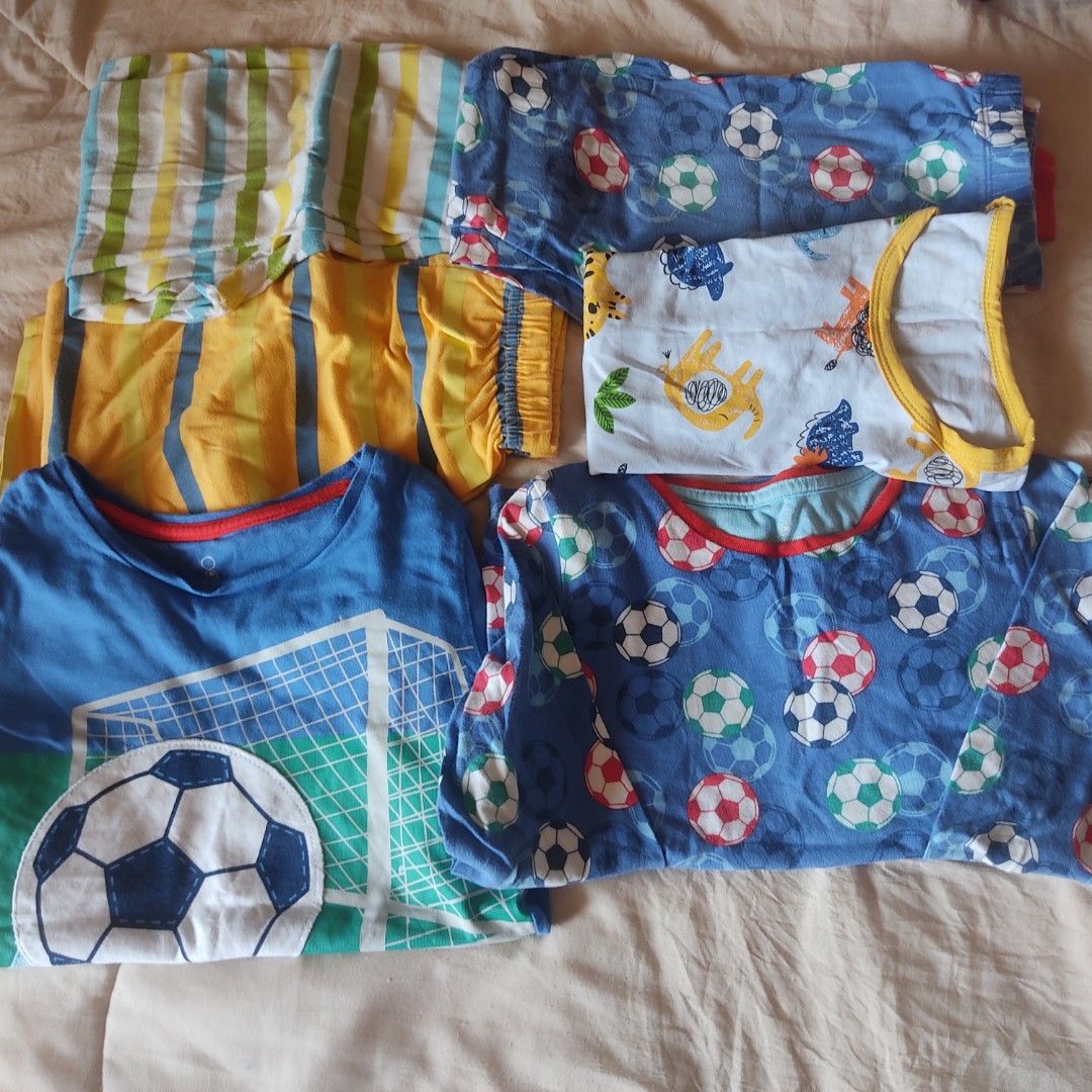 Sleepwear pajama bundle kids (Category: Babies & Kids Fashion) located in Las Pinas. Submitted by minimy (Listing ID 1470566945, Image 1). Description: - Bundle includes: Blue soccer long sleeve top, white dinosaur top with yellow trim, blue soccer pants, yellow/grey striped pants, green/white striped shorts, and blue soccer net graphic tee - Material: Soft 100% cotton - Ideal for: Everyday sleepwear or play clothes - Condition: Sold as a complet