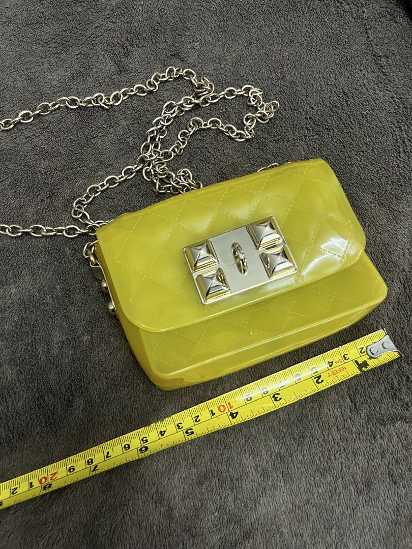 Small yellow Jelly sling bag gold harware (Category: Babies & Kids Fashion) located in Paranaque City. Submitted by regina_sy (Listing ID 1470612352, Image 3). Description: With stain at the back MOP: GCASH J&T Express delivery (SF c/o BUYER) NO WW photo 📍Pque MM .