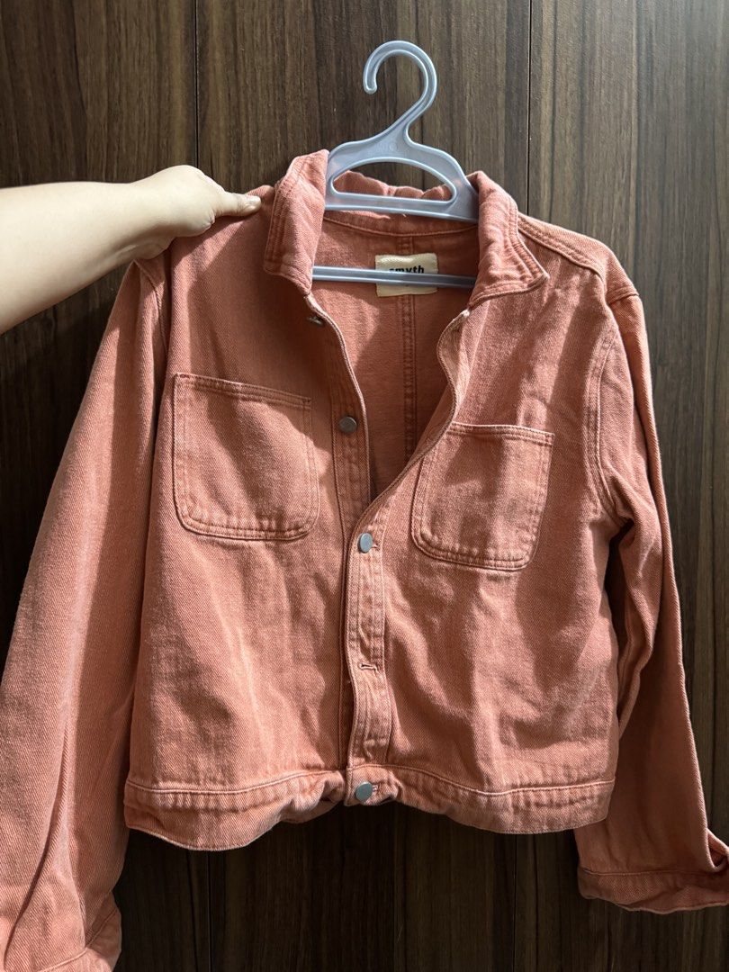 Smyth Pink Denim Jacket Size S (Category: Coats, Jackets and Outerwear) located in Manila. Submitted by m.pat (Listing ID 1470681675, Image 1). Description: - Brand: Smyth - Color: Pink - Size: Small - Style: Cropped denim jacket with button-up front and collared neckline - Details: Two functional chest pockets - Material: Sturdy cotton fabric, perfect for layering.