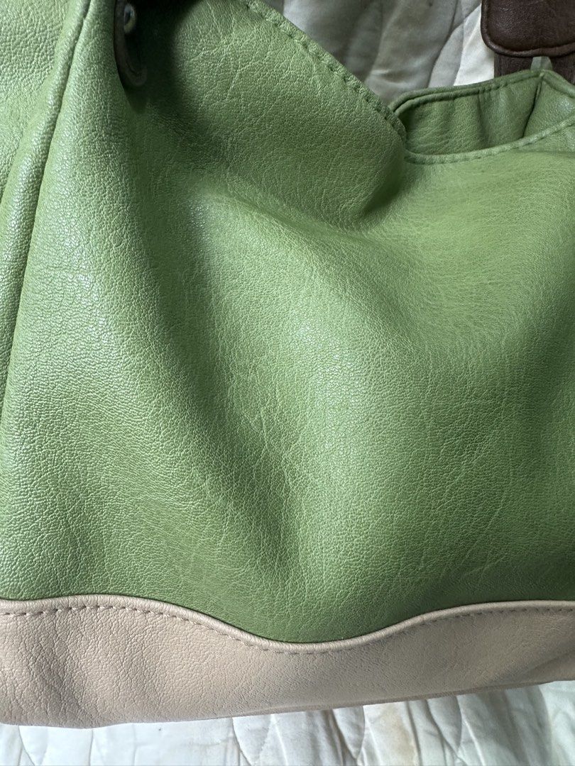 Soft Leather Tote Shoulder Bag from Japan (Category: Tote Bags) located in Santa Rosa. Submitted by esplanamur03635 (Listing ID 1470692672, Image 3). Description: - Color: Green soft leather with brown straps and neutral beige base - Size: Medium, structured shape - Interior: Fully lined with slip pockets and one zipper pocket magnetic lock - Straps: Sturdy handles, comfortable for shoulder wear, lightweight - Condition: Clean inside and out Perf