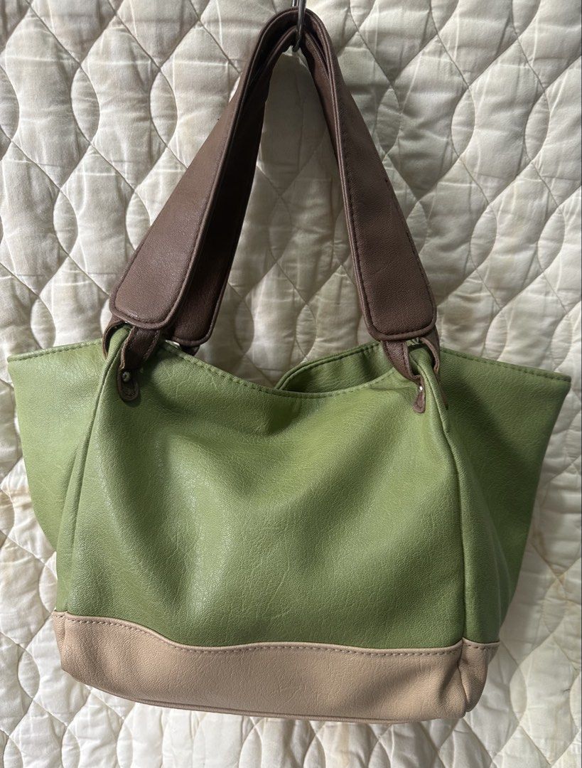 Soft Leather Tote Shoulder Bag from Japan (Category: Tote Bags) located in Santa Rosa. Submitted by esplanamur03635 (Listing ID 1470692672, Image 1). Description: - Color: Green soft leather with brown straps and neutral beige base - Size: Medium, structured shape - Interior: Fully lined with slip pockets and one zipper pocket magnetic lock - Straps: Sturdy handles, comfortable for shoulder wear, lightweight - Condition: Clean inside and out Perf