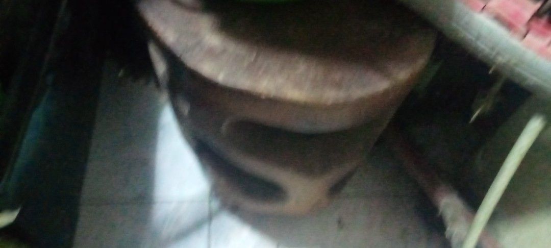 Solid Wooden Stool Round Chair (Category: Chairs) located in Paranaque City. Submitted by dimaguilaa24827 (Listing ID 1470654422, Image 1). Description: - Material: Heavy solid wood with natural grain finish - Design: Round top with unique cut-out carved details along the base - Condition: Sturdy and structurally sound, with minor surface scuffs from regular use - Use: Versatile piece, great for seating or as an extra display space around the hou