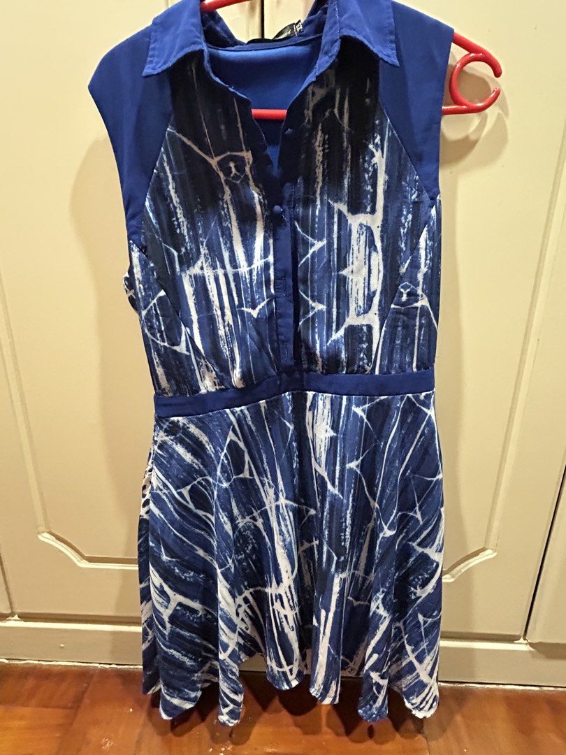 Something Borrowed Blue Patterned Shirt Dress XS (Category: Dresses) located in Manila. Submitted by jag888 (Listing ID 1470645400, Image 1). Description: - Brand: Something Borrowed - Size: XS - Color/Pattern: Blue and white with abstract print and solid blue shoulder panels - Neckline & Closure: Collared with front button closure - Design: Sleeveless with a fitted waistline - Material: Lightweight, comfortable, and ready to wear.