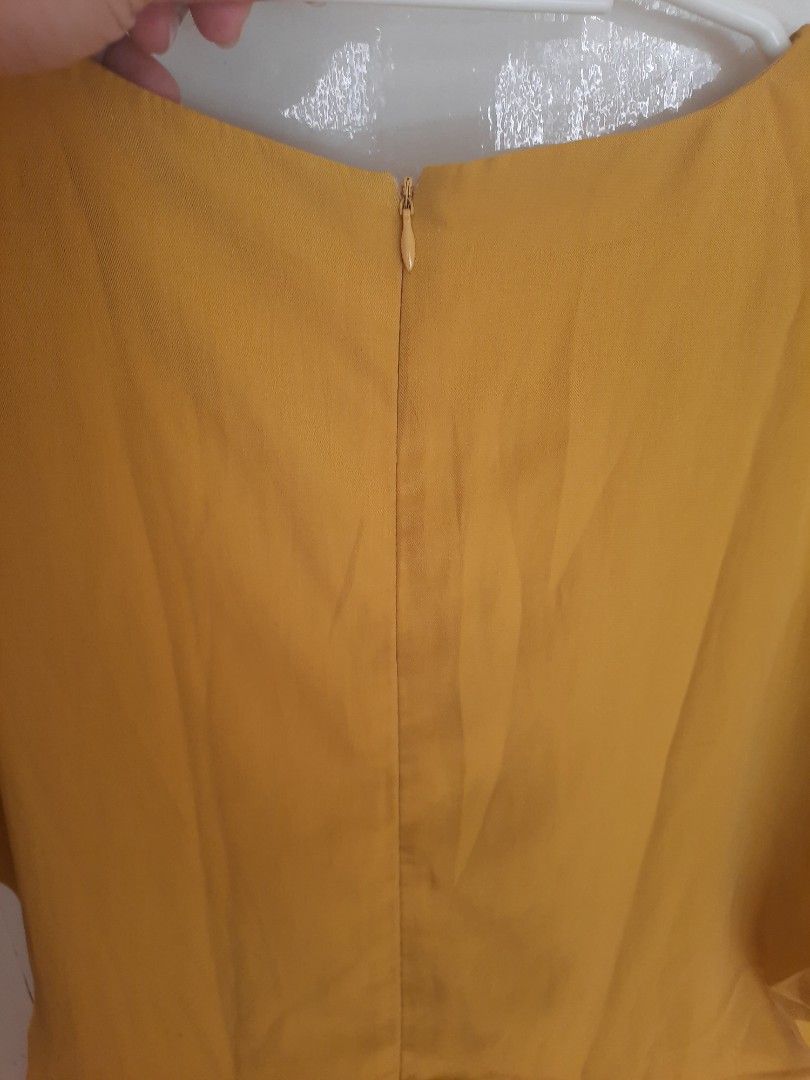Something Borrowed Surplice V-Neck Short Romper (Category: Rompers) located in Quezon City. Submitted by dannikkishoppe2 (Listing ID 1470680650, Image 3). Description: Something Borrowed Surplice V-Neck Short Romper ‼️₱400‼️ • Color: Mustard Yellow / Golden Yellow • Neckline: Deep V-neck with a faux-wrap (surplice) front • Sleeves: Relaxed, loose kimono-style short sleeves • Legs: Relaxed, wide-leg shorts • Closure: Back zipper closure • Worn onc