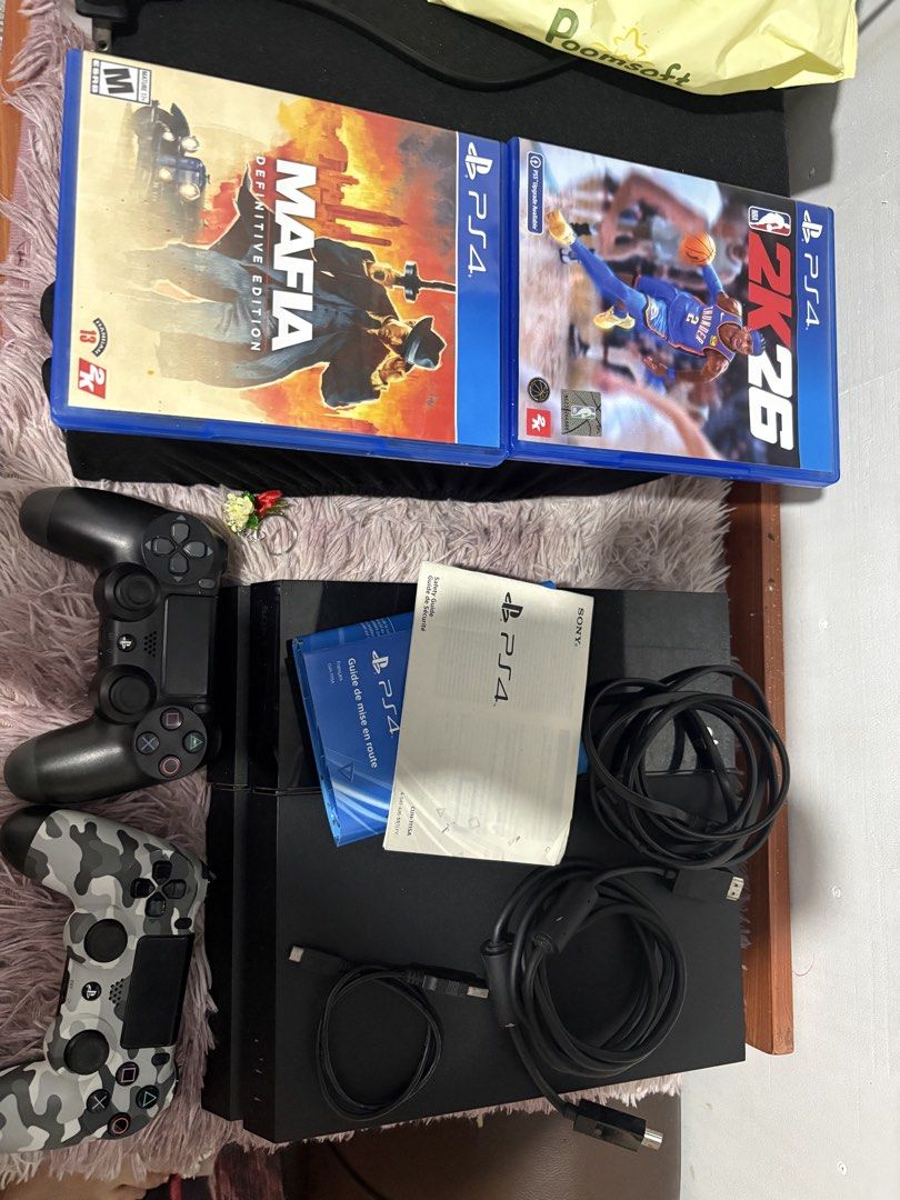 Sony PlayStation 4 Console with 2 Controllers and Games (Category: PlayStation) located in Makati City. Submitted by wpglyn (Listing ID 1470579293, Image 1). Description: Original 2 controllers Original HDMI cable Original Power cable Usb charging cable PS4 Manual and booklets 2k26 game Disc Mafia definitive edition game Disc Issue black controller not working. Rfs may Ps5 na.