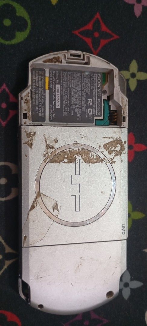 Sony PSP-3001 Handheld Console Silver (Category: PlayStation) located in Manila. Submitted by jhonevanma58082 (Listing ID 1470689947, Image 2). Description: - Model: Sony PSP-3001 Handheld Console (Silver Finish) - Condition: Untested, selling as-is for parts or restoration - Flaws: Heavy scratches on screen and body, dirt/wear buildup on back and buttons - Missing Parts: Battery pack and battery cover door - Note: Bring your own battery and char