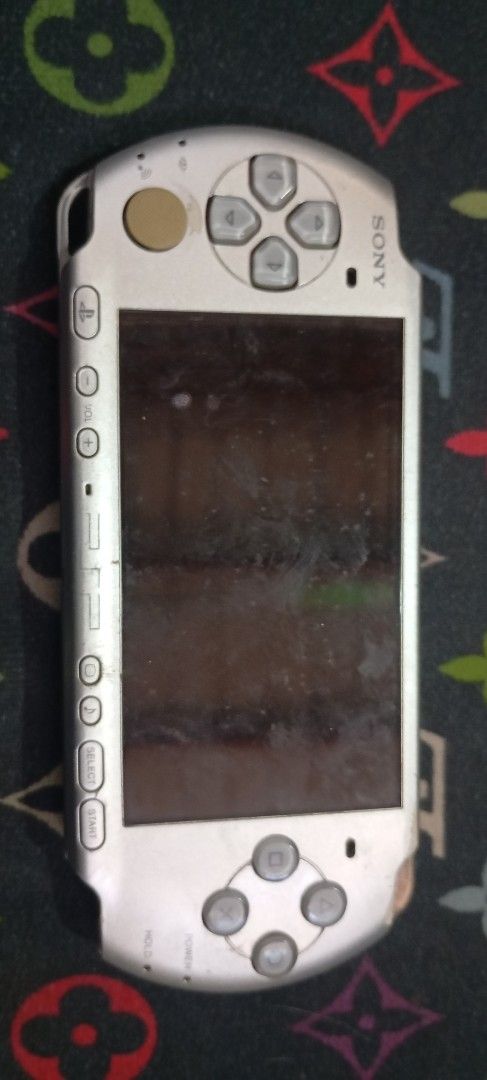 Sony PSP-3001 Handheld Console Silver (Category: PlayStation) located in Manila. Submitted by jhonevanma58082 (Listing ID 1470689947, Image 1). Description: - Model: Sony PSP-3001 Handheld Console (Silver Finish) - Condition: Untested, selling as-is for parts or restoration - Flaws: Heavy scratches on screen and body, dirt/wear buildup on back and buttons - Missing Parts: Battery pack and battery cover door - Note: Bring your own battery and char