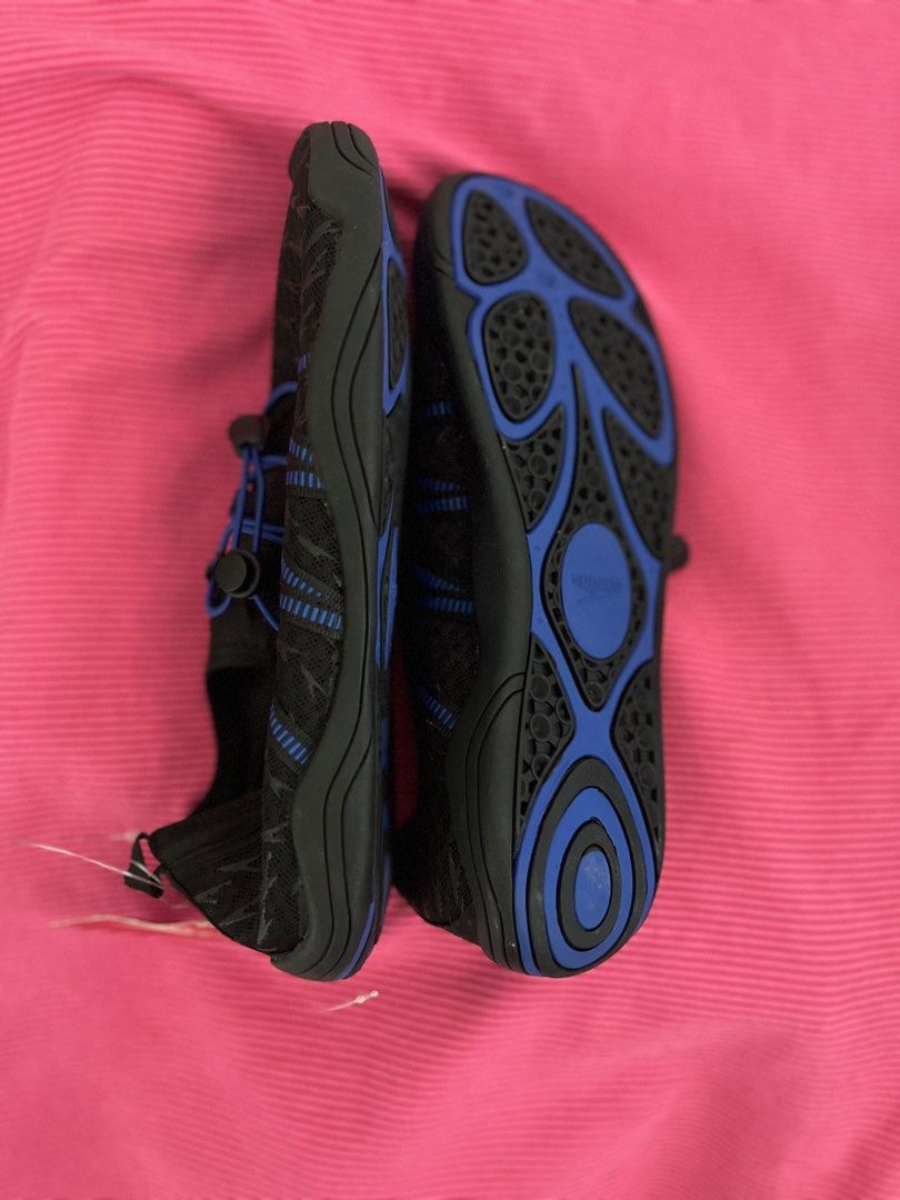 Speedo Water Shoes (Category: Water Sports) located in Manila. Submitted by zellie11 (Listing ID 1470560862, Image 2). Description: - Brand: Speedo - Condition: Brand new with original store tag attached - Color: Black with blue accents and patterned uppers - Closure: Slip-on design with adjustable bungee lace and toggle - Sole: Non-slip blue and black rubber outsole for superior grip on wet surfaces - Ideal for: Swimming, beach trips, water spor