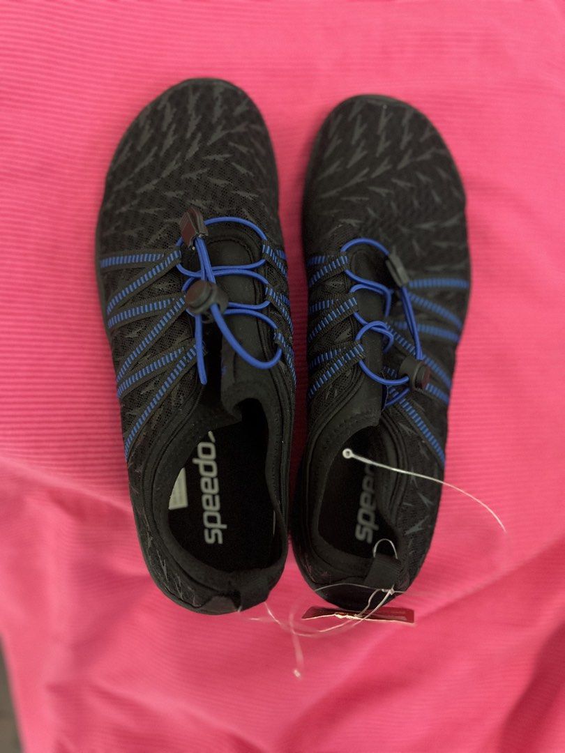 Speedo Water Shoes (Category: Water Sports) located in Manila. Submitted by zellie11 (Listing ID 1470560862, Image 1). Description: - Brand: Speedo - Condition: Brand new with original store tag attached - Color: Black with blue accents and patterned uppers - Closure: Slip-on design with adjustable bungee lace and toggle - Sole: Non-slip blue and black rubber outsole for superior grip on wet surfaces - Ideal for: Swimming, beach trips, water spor