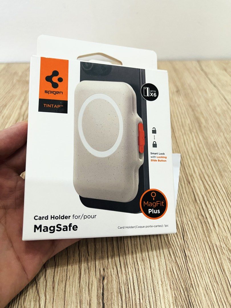 Spigen Magsafe Card Holder and wallet (Category: Cases & Sleeves) located in Quezon City. Submitted by ccgem (Listing ID 1470639685, Image 1). Description: Spigen Magfit + Card Holder TinTap wallet Color: Dune Beige Bought at ₱2900, selling very low Good as new Very very strong magnetic attachment Has integrated magsafe on top for popsockets Can hold up to 6 cards plus bills Built-in lock feature Non-staining, keeps its clean looking color RFS: b