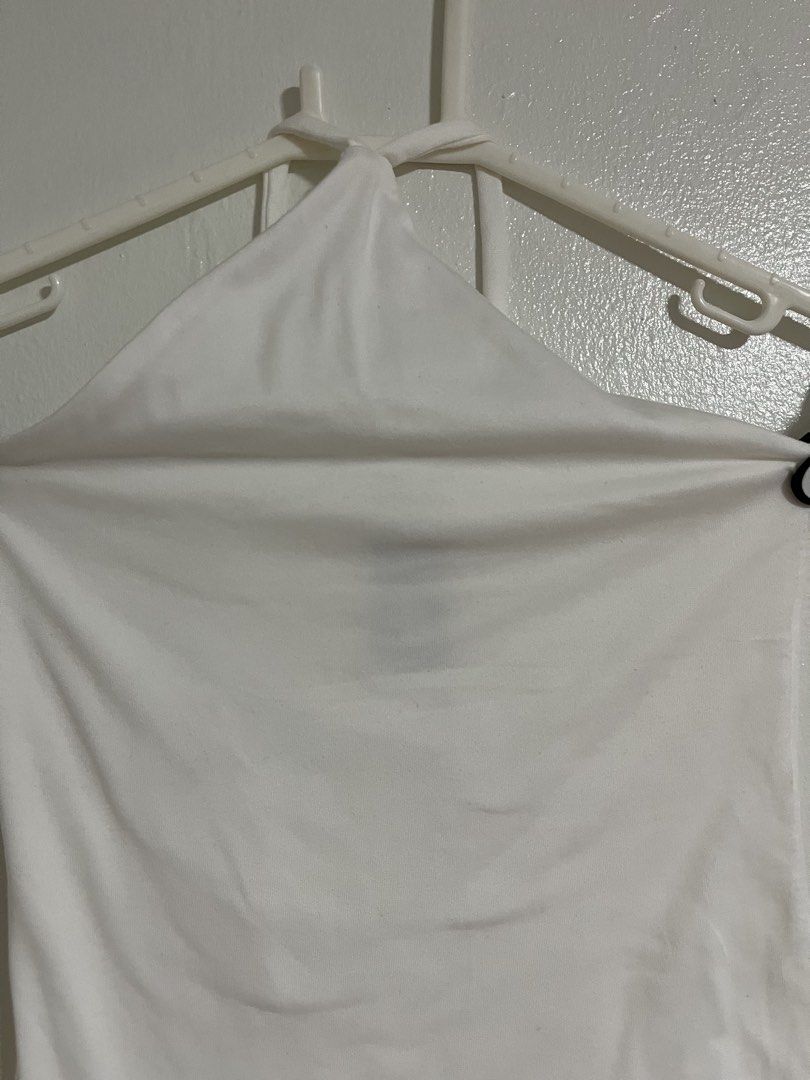 Sponty White Halter Top (Category: Sleeveless) located in Cabuyao City. Submitted by rdtrmt (Listing ID 1470742977, Image 2). Description: - Brand: Sponty - Size: Small - Color: Clean White - Style: Halter top with simple tube design and neck straps - Material: Stretchy and comfortable - Condition: excellent and still in good condition .