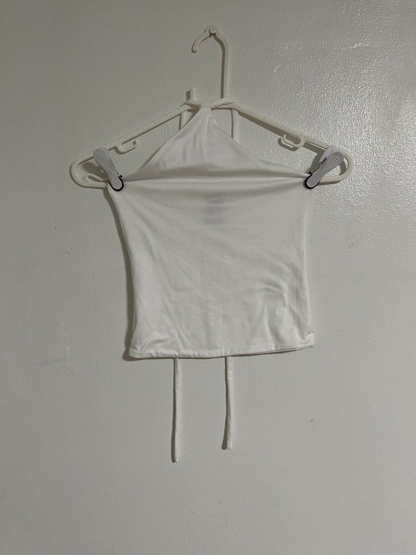 Sponty White Halter Top (Category: Sleeveless) located in Cabuyao City. Submitted by rdtrmt (Listing ID 1470742977, Image 1). Description: - Brand: Sponty - Size: Small - Color: Clean White - Style: Halter top with simple tube design and neck straps - Material: Stretchy and comfortable - Condition: excellent and still in good condition .