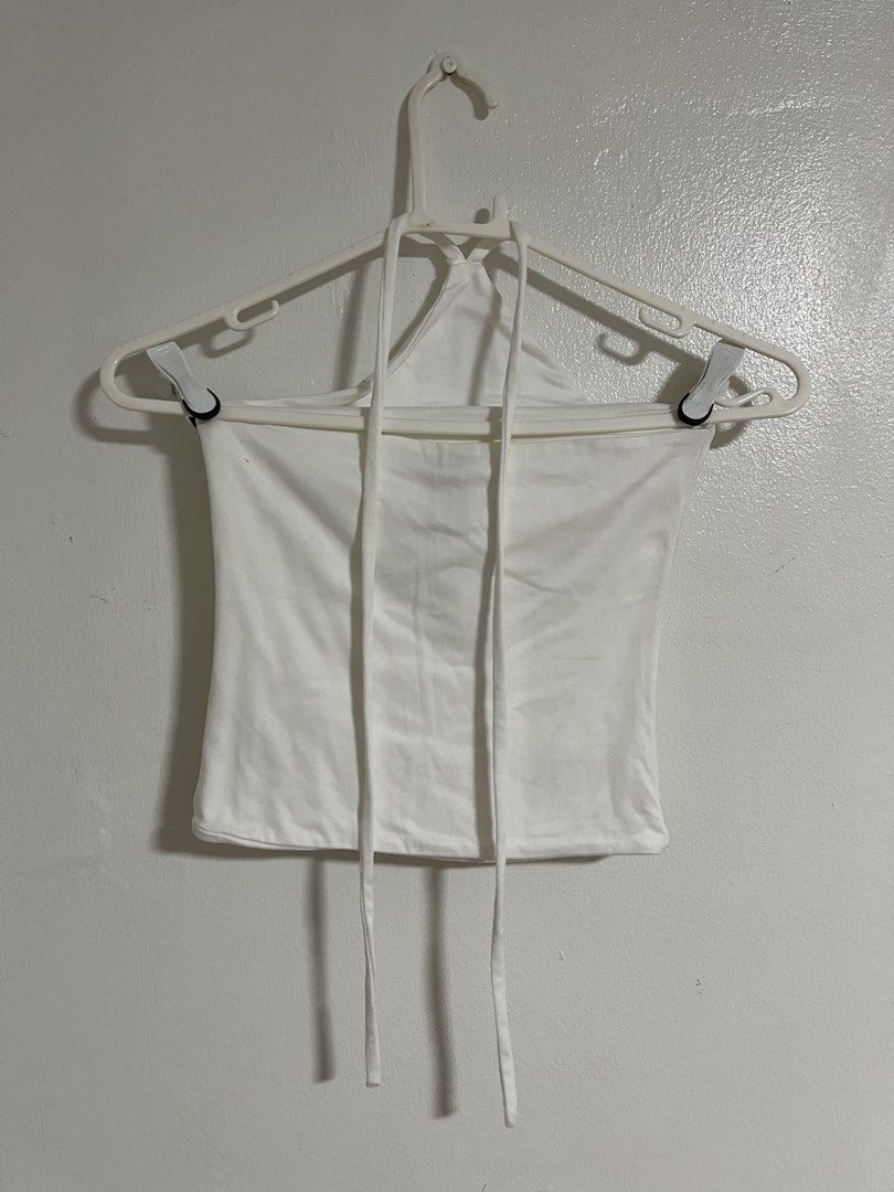 Sponty White Halter Top (Category: Sleeveless) located in Cabuyao City. Submitted by rdtrmt (Listing ID 1470742977, Image 3). Description: - Brand: Sponty - Size: Small - Color: Clean White - Style: Halter top with simple tube design and neck straps - Material: Stretchy and comfortable - Condition: excellent and still in good condition .