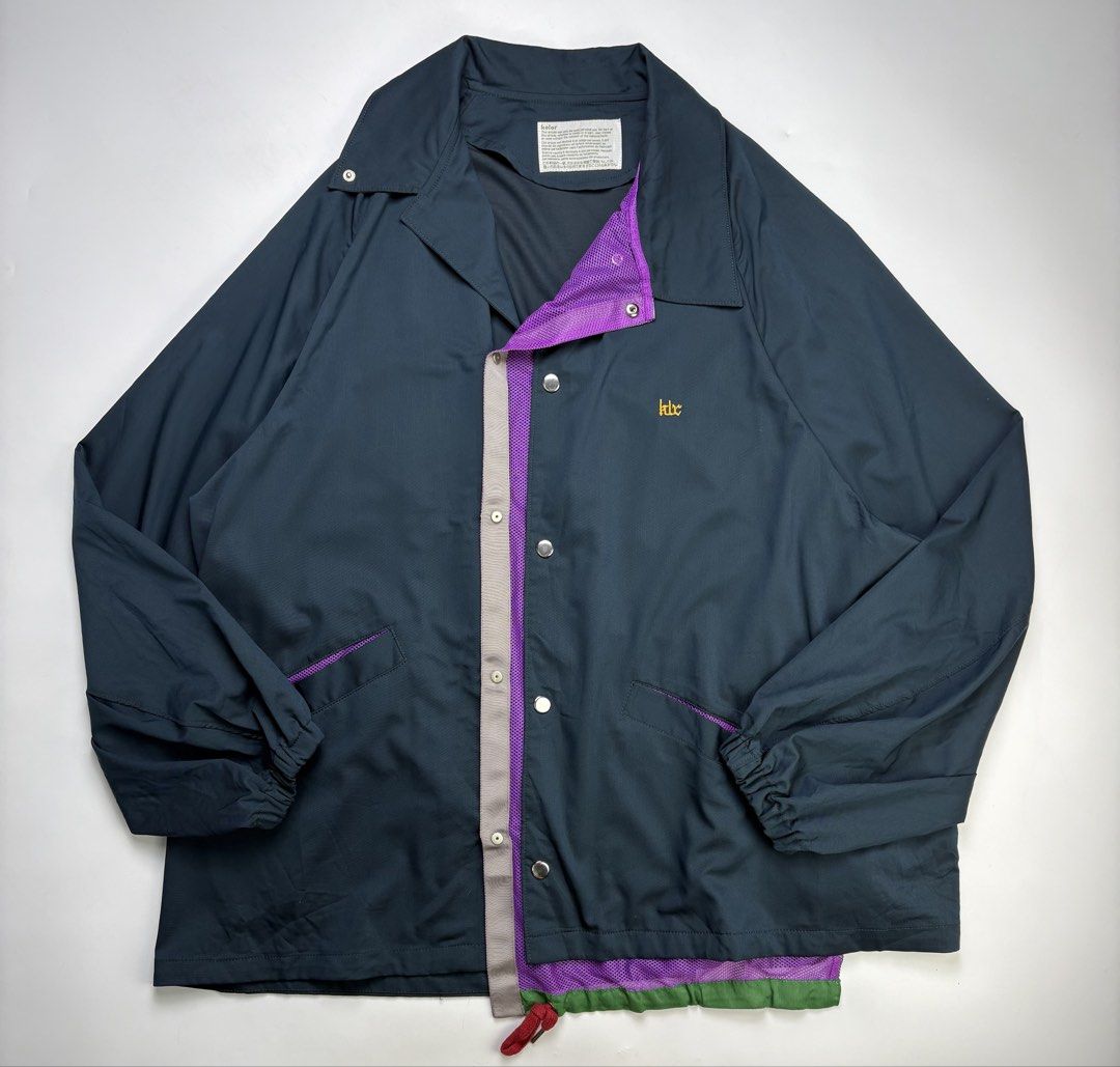 S/S23 Kolor Viscose Nylon Coach Jacket (Category: Coats, Jackets and Outerwear) located in Cavite. Submitted by sc_rcity (Listing ID 1470706924, Image 2). Description: Tagged Size : Large Like New Made in Japan Sign of Wear No Inclusion Features a distinct “peeled-back” or deconstructed double-front placket. This reveals a vibrant purple mesh inner layer and an offset grey snapping panel. Measurements: in inches (approx.) Width 25.5 Length 29.