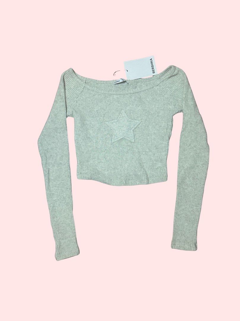 Star Patch Off-Shoulder Crop Top (Category: Longsleeves) located in Pasig City. Submitted by kia.sell (Listing ID 1470576522, Image 1). Description: - Brand: Bershka - Style: Long-sleeve off-shoulder ribbed knit crop top - Color: Heather Light Gray / Mint Off-White - Design Details: Star patch on the chest, elasticized scoop/off-shoulder neckline, fine-ribbed stretch fabric. - Condition: Brand New with Tags (NWT / Pristine, never worn) - Size: S 