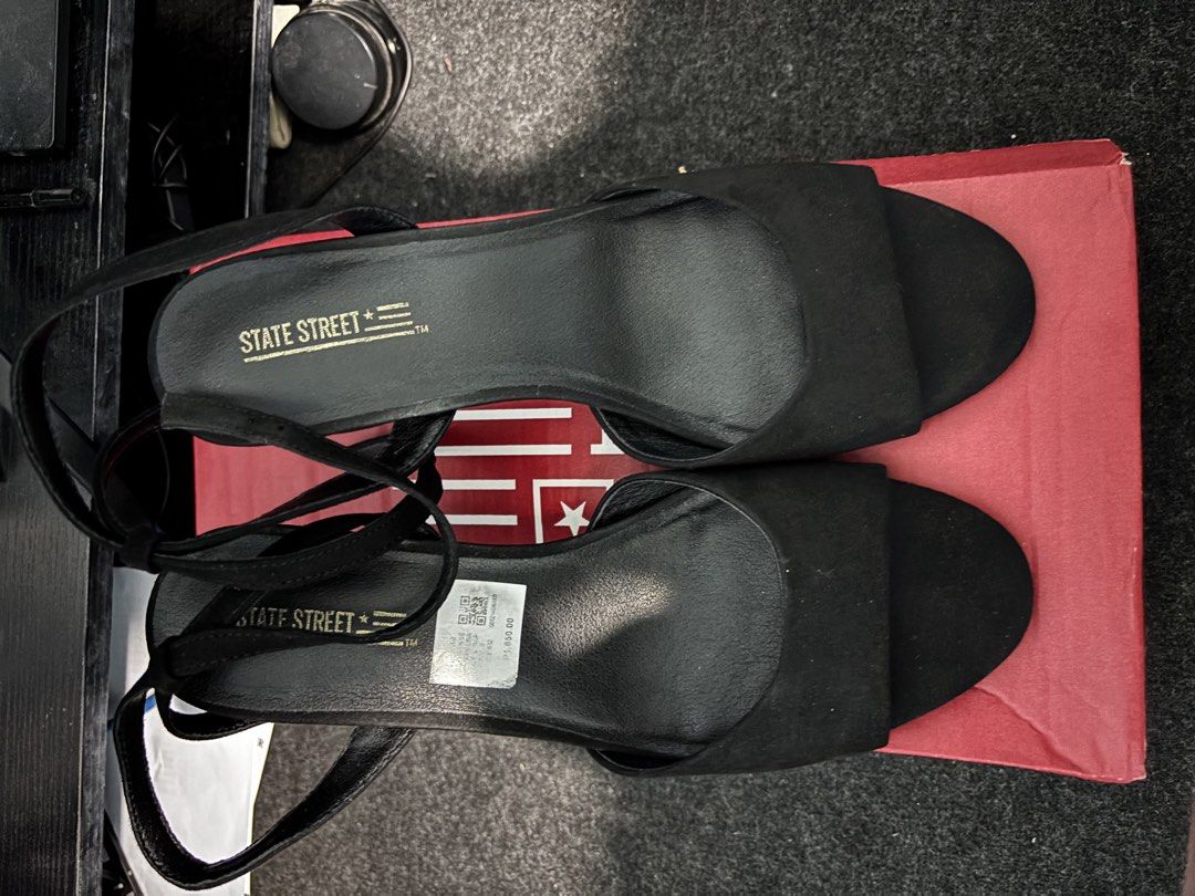 State Street Black Heels Sandals Size 9 (Category: Heels) located in Makati City. Submitted by jinjinmaeherher (Listing ID 1470697210, Image 2). Description: - Brand: State Street - Style: Black strappy heels with slim heel and open toe - Size: 9 - Closure: Slender ankle strap with buckle - Condition: Soles have minor scuffs. Worn once, Oct 16, 2026 - Inclusions: Original State Street shoe box. May yupi yung box, ayun na lang daw available sa sto
