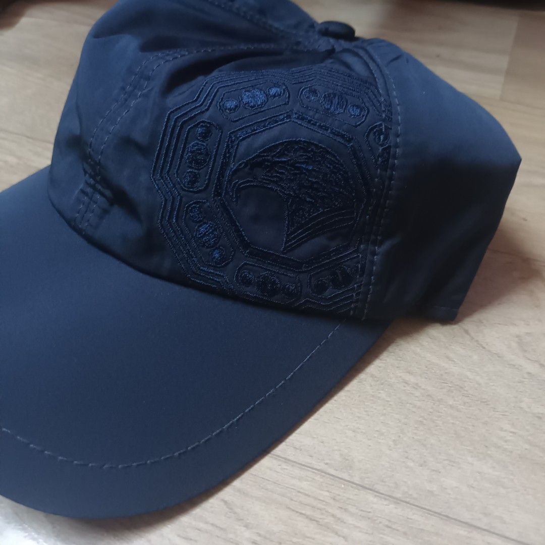 Stefano Ricci Navy Blue Cap (Category: Caps & Hats) located in Manila. Submitted by itsnik444 (Listing ID 1470634444, Image 2). Description: - Brand: Stefano Ricci - Color: Dark blue - Design: Detailed eagle embroidery on the side panel - Interior: Grey jersey lining with an orange ribbed sweatband - Fit: Elasticated back section - Condition: Clean inside and out, made with premium quality materials.
