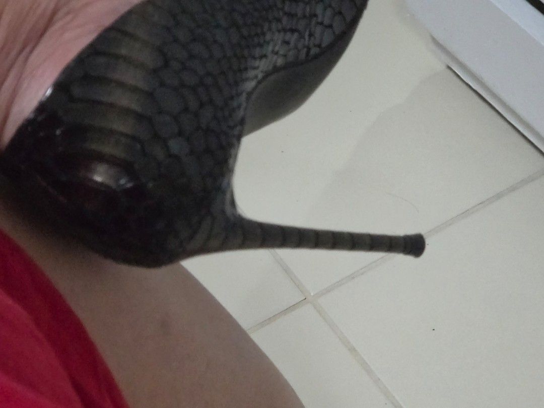 Steve Madden Snake Print Stiletto Heels (Category: Heels) located in Taguig. Submitted by m_lim (Listing ID 1470697785, Image 2). Description: - Brand: Steve Madden - Design: Pointed toe with glossy black and grey snake print pattern - Heel: Ultra-thin stiletto with a textured metallic finish - Soles: Equipped with extra grip pads on the forefoot for stability - Interior: Clean insoles featuring clear brand logo - Condition: Excellent, clean cond