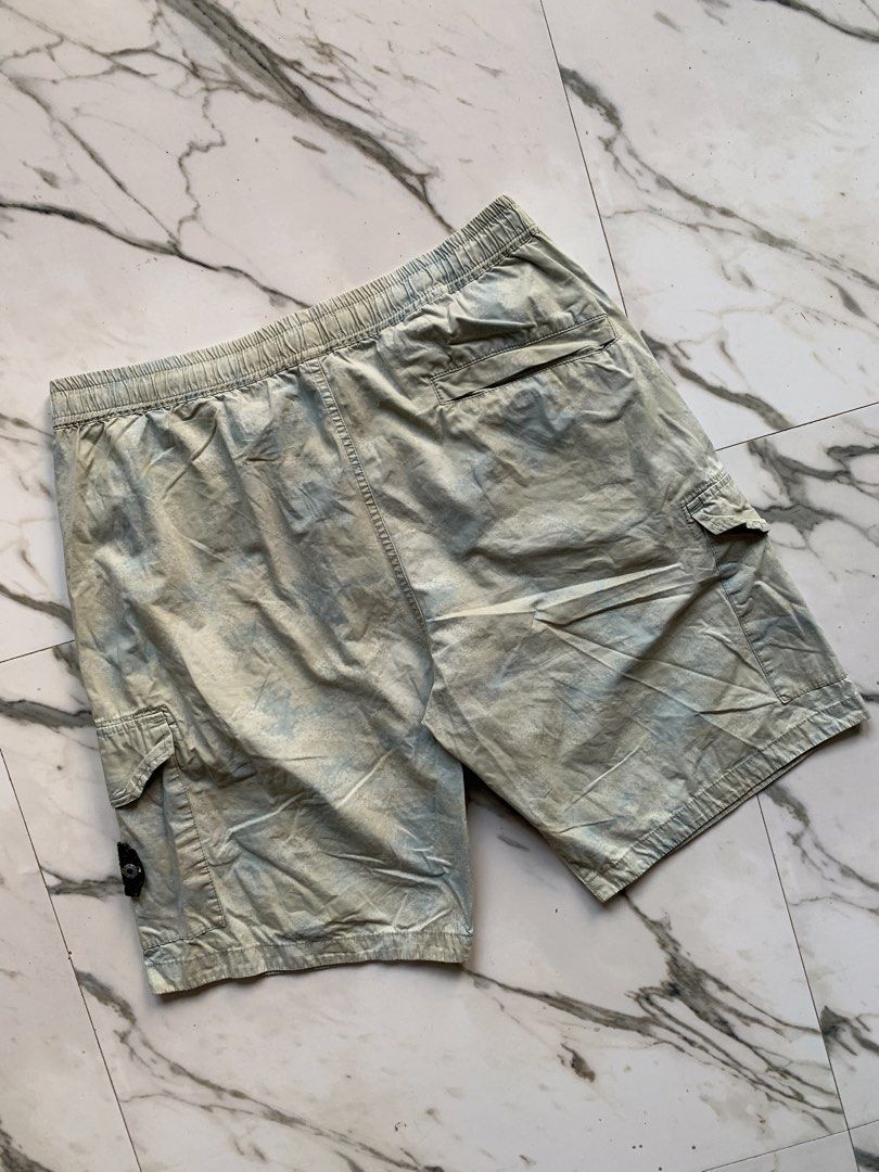 STONE ISLAND UTILITY-CARGO LIGHT CAMO SHORTS (Category: Shorts) located in Dagupan City. Submitted by re.worth.dgpn.ph (Listing ID 1470700817, Image 3). Description: - Authentic Stone Island cargo shorts - Trendy acid wash finish - Elastic waistband with adjustable drawstring - Secure zippered side pockets - Practical snap-flap cargo pockets and single back pocket - Verified authentic with internal Certilogo tag.