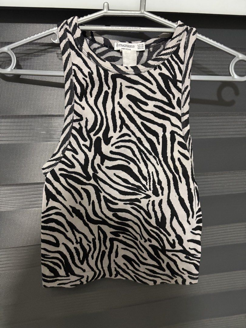stradivarius zebra top (Category: Sleeveless) located in Manila. Submitted by iyahpreloved_ (Listing ID 1470689375, Image 1). Description: size S-M very stretchy.