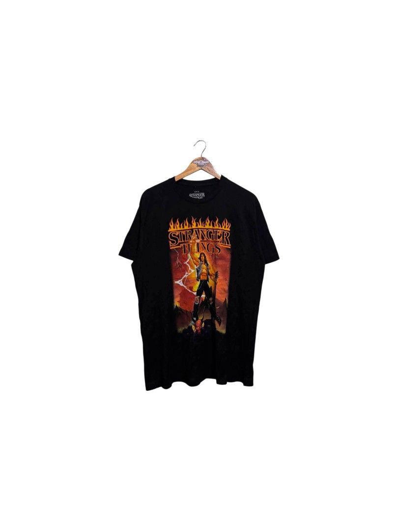 Stranger Things Shirt (Category: Tshirts & Polo Shirts ) located in Bauan. Submitted by onetwothrift2 (Listing ID 1470665857, Image 1). Description: Stranger Things Shirt Size: Large Dimes: L30.5 W22 Color rate: 10/10 As new condition No issue Mine: 700.