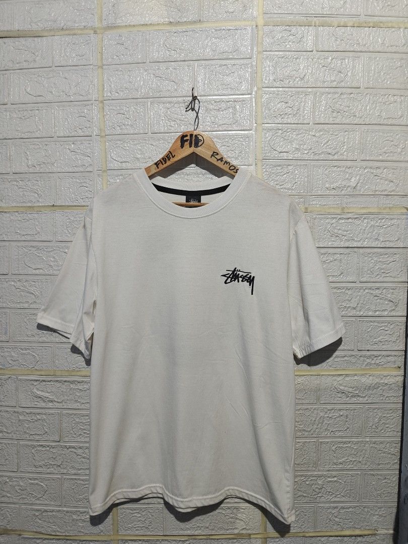 Stussy 8 Ball Angel White Tee (Category: Tshirts & Polo Shirts ) located in Manila. Submitted by fideldelrosario1 (Listing ID 1470637129, Image 1). Description: 22BY28 - Brand: Stussy - Color: Crisp white - Size: MEDIUM - Design: Small chest logo with large winged 8-ball graphic on the back - Fit: Standard fit with crew neck and black inner collar tape - Condition: Excellent, clean with no stains or holes - Shipping: Ships fast from the Philippin