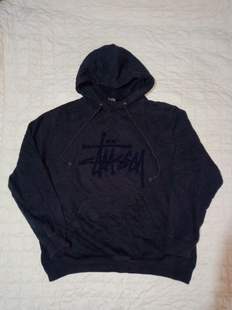 Stussy Dark Navy Hoodie Size Medium (Category: Coats, Jackets and Outerwear) located in Allen. Submitted by milyonaryung_gipit (Listing ID 1470567284, Image 1). Description: - Brand: Stussy - Size: Medium - Color: Dark Navy - Material: 80% Cotton, 20% Polyester (Made in China) - Features: Large embroidered signature chest logo, front kangaroo pocket, adjustable drawstring hood, ribbed cuffs and hem - Condition: Shows slight fading from washing, w