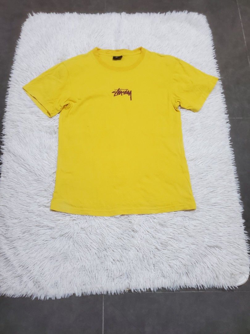 Stussy Yellow T-Shirt Small (Category: Tshirts & Polo Shirts ) located in Manila. Submitted by royalrabbit.7b2a11 (Listing ID 1470696465, Image 1). Description: - Brand: Stussy - Color: Bright yellow with dark brown signature logo - Size: Small - Material: 100% cotton (Made in Mexico) - Condition: Excellent, with wash tag and brand label intact - Style: Classic crew neck, short sleeves.