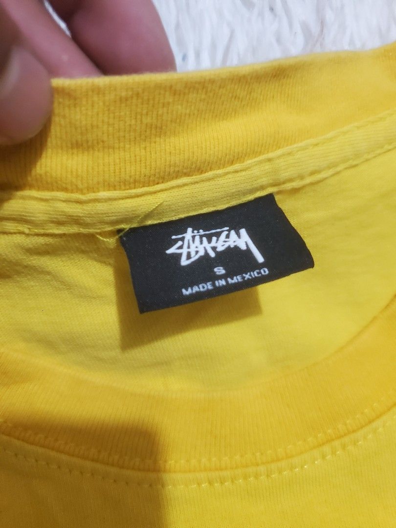 Stussy Yellow T-Shirt Small (Category: Tshirts & Polo Shirts ) located in Manila. Submitted by royalrabbit.7b2a11 (Listing ID 1470696465, Image 2). Description: - Brand: Stussy - Color: Bright yellow with dark brown signature logo - Size: Small - Material: 100% cotton (Made in Mexico) - Condition: Excellent, with wash tag and brand label intact - Style: Classic crew neck, short sleeves.