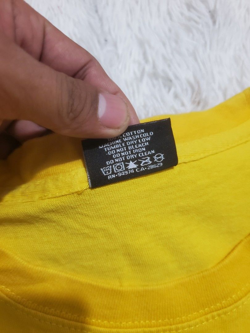 Stussy Yellow T-Shirt Small (Category: Tshirts & Polo Shirts ) located in Manila. Submitted by royalrabbit.7b2a11 (Listing ID 1470696465, Image 3). Description: - Brand: Stussy - Color: Bright yellow with dark brown signature logo - Size: Small - Material: 100% cotton (Made in Mexico) - Condition: Excellent, with wash tag and brand label intact - Style: Classic crew neck, short sleeves.