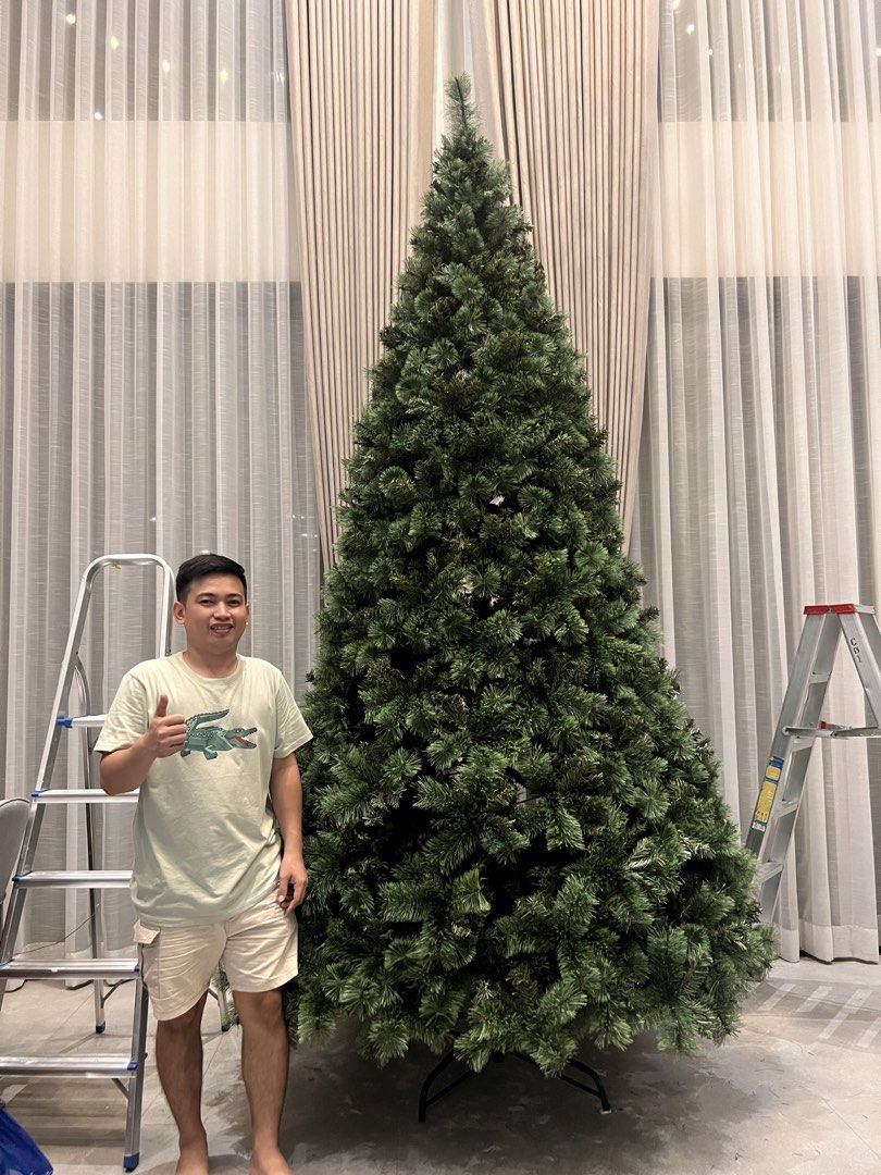 Sugar vinyl Christmas Tree (Category: Artificial Plants & Flowers) located in Manila. Submitted by jamesgani08 (Listing ID 1470569325, Image 3). Description: - Big and tall green artificial Christmas tree, perfect for high ceilings - Full branches featuring realistic pine needle tips - Sturdy metal stand included at the base - Complete holiday bundle: includes string lights and red & silver bauble ornaments - Easy to assemble and ready to bring f