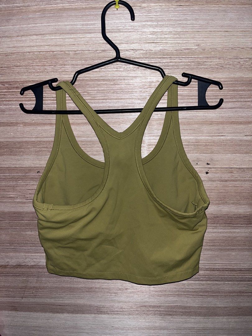 Sung , Addiddas and Preloved Tops (Category: Activewear) located in Manila. Submitted by fastflower.4b5f11 (Listing ID 1470741194, Image 1). Description: Athletic tank top from Sung in a pale green shade. Size small on the tag. Racerback design with a twisted cross back detail. Soft fabric blend of 89% polyester and 11% spandex, made in the USA. Curved hemline with a small logo tag near the bottom. Great piece for workouts or casual activewear da