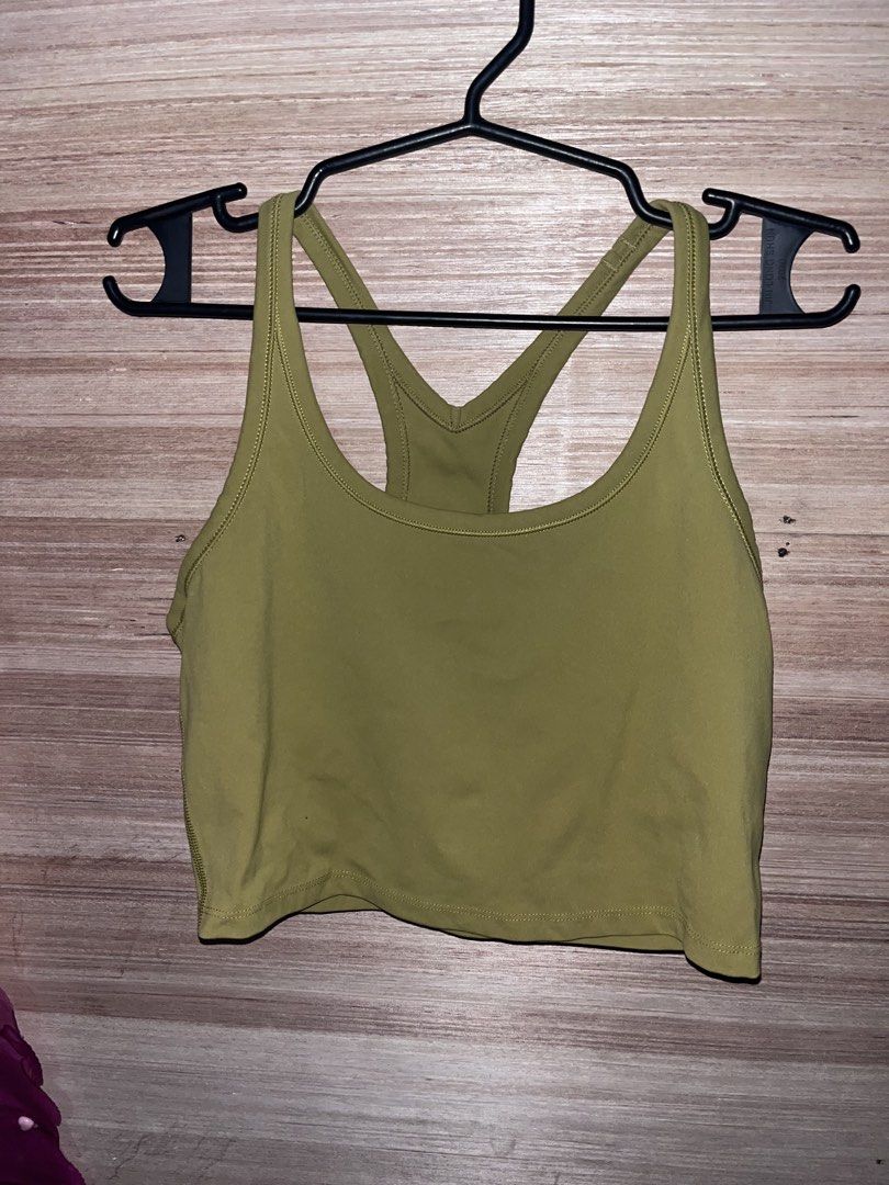 Sung , Addiddas and Preloved Tops (Category: Activewear) located in Manila. Submitted by fastflower.4b5f11 (Listing ID 1470741194, Image 2). Description: Athletic tank top from Sung in a pale green shade. Size small on the tag. Racerback design with a twisted cross back detail. Soft fabric blend of 89% polyester and 11% spandex, made in the USA. Curved hemline with a small logo tag near the bottom. Great piece for workouts or casual activewear da