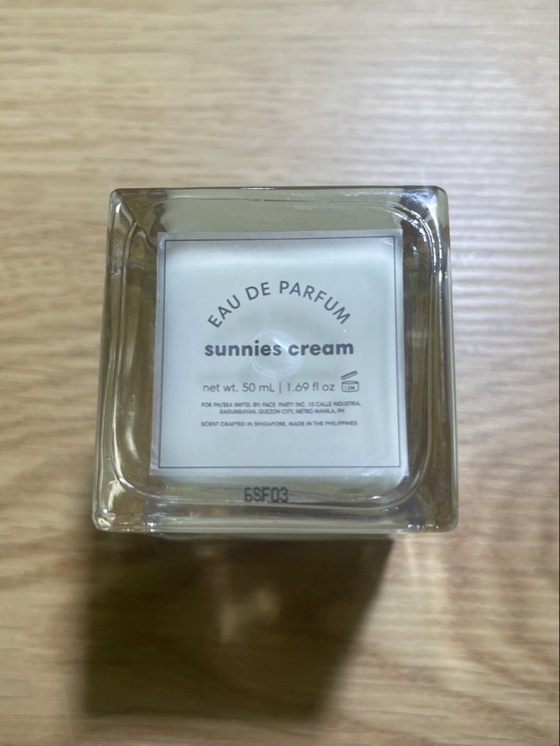Sunnies Cream Eau De Parfum 50ml (Category: Fragrance & Deodorants) located in Calasiao. Submitted by shoparen14525 (Listing ID 1470579147, Image 3). Description: - Brand: Sunnies Cream Eau de Parfum - Size: 50ml bottle - Scent Profile: Fresh citrus (bergamot, mandarin, lemon), soft floral (lily of the valley, peony, cotton), and warm base (sandalwood, ambroxan, musk) -used twice only .