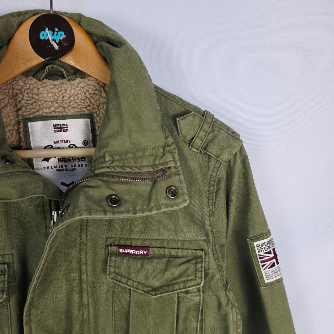 Superdry Army Green Field Jacket (Category: Coats, Jackets and Outerwear) located in Pasig City. Submitted by driplocale (Listing ID 1470681263, Image 3). Description: Superdry Army Green Field Jacket Condition 9.5/10 (Pristine Condition✨) Size: Small Chest Width: 19.5inches Shoulder Width: 17.5inches Length (Shoulder to Hem): 30inches.