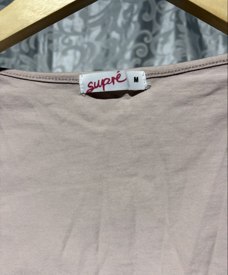 Supré Beige Long Sleeve Crop Top Size M (Category: Longsleeves) located in Cavite. Submitted by grandearth.39df3f (Listing ID 1470557483, Image 3). Description: - Brand: Supré - Style: Long sleeve crop top with square neckline - Color: Light Pink - Size: Medium (M) - Material: Soft, stretchy cotton - Fit: Slim fit, plain back - Condition: Great basic piece for layering or daily wear - Ships out immediately via J&T/Flash.