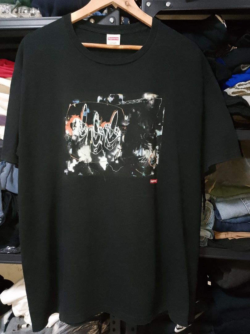 Supreme Black Graphic Tee Size XL (Category: Tshirts & Polo Shirts ) located in Manila. Submitted by mjthrifted_second (Listing ID 1470615610, Image 1). Description: - Brand: Supreme - Color: Black - Size: XL -Dimes: 25/30 - Material: 100% pre-shrunk cotton, Made in U.S.A. - Fit: Standard short sleeve crew neck - Front Design: Large abstract artwork graphic with small red Supreme box logo - Back Design: Large white handwritten-style Supreme lette