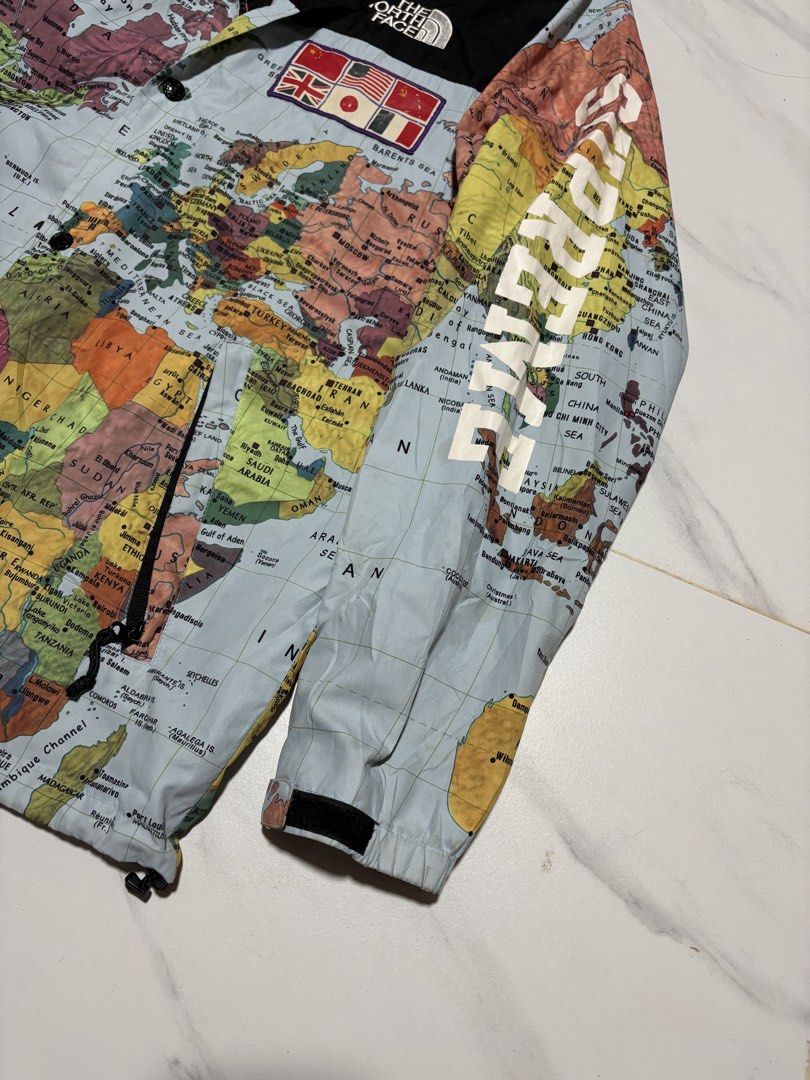 Supreme x The North Face Map Jacket (Category: Coats, Jackets and Outerwear) located in Baguio. Submitted by thriftedbaguio (Listing ID 1470596664, Image 3). Description: Very Good Condition Size Xlarge Tagged Dimensions 23*29 Color rate 10 Very minor cracks on print.