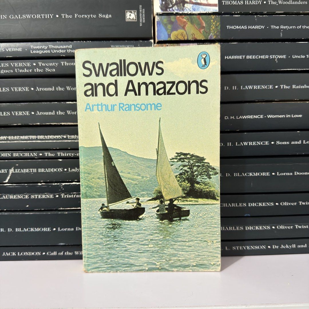 Swallows and Amazons by Arthur Ransome Paperback (Category: Storybooks) located in Lingayen. Submitted by readwjane (Listing ID 1470704635, Image 1). Description: - Title: Classic Adventure Novel by Arthur Ransome - Edition: Puffin paperback with iconic sailboat cover - Condition: Clean copy, all pages intact, moderate shelf wear on edges and spine - Audience: Perfect for older kids and nostalgic adults.