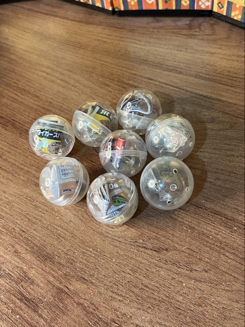 Take All Capsule Pin Badges Collectibles (Category: Vintage Collectibles) located in Gapan. Submitted by lunashop14 (Listing ID 1470630165, Image 1). Description: - Complete set of 8 Hanshin Tigers 70th anniversary pin badges - Each unique metal pin comes inside its original sealed transparent capsule - Features official team logos, player numbers, and commemorative designs - Must-have memorabilia for NPB baseball fans and serious collectors ₱200