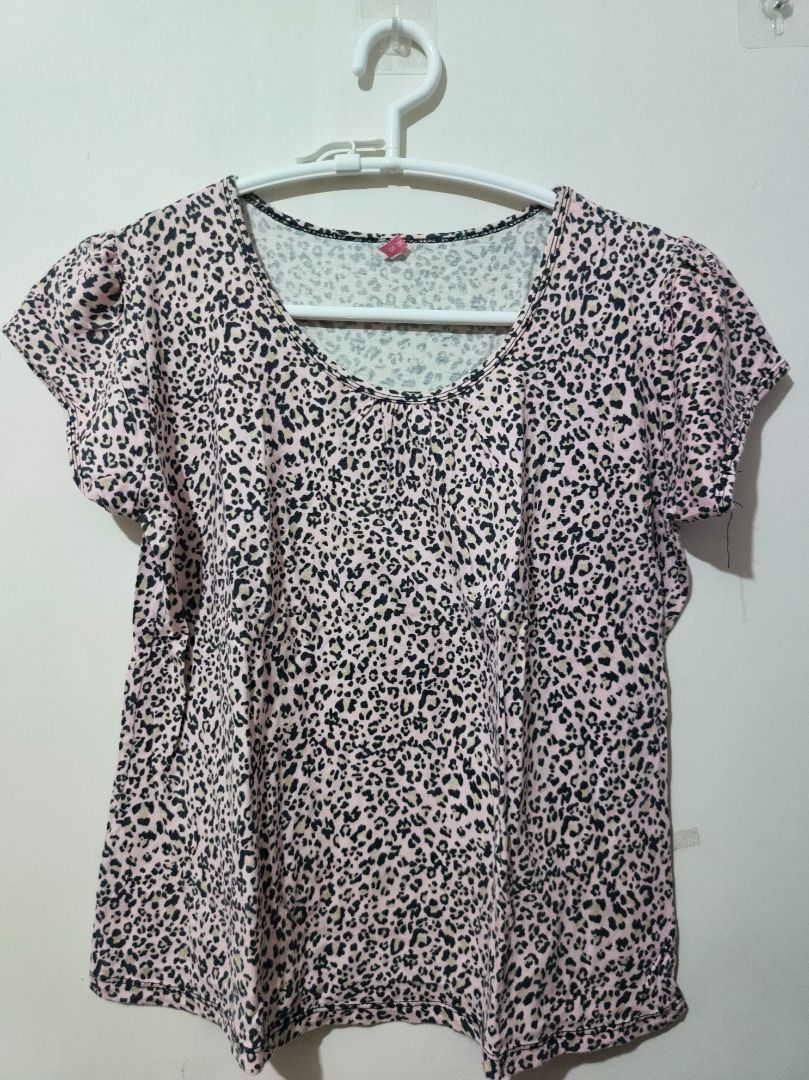 TBS Pink Leopard Print Cap-Sleeve Blouse (Size M/L) (Category: Shirts) located in San Leonardo. Submitted by burgossanleonardo.12345 (Listing ID 1470675740, Image 1). Description: [CASUAL STAPLE] Lightweight and airy short-sleeve top featuring an all-over pink and black leopard animal print. Designed with subtle smocking details along the round scoop neckline and feminine gathered cap sleeves. Made from a very soft, breezy fabric that keeps you c