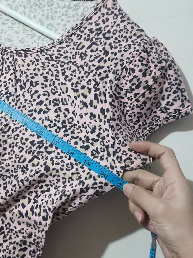 TBS Pink Leopard Print Cap-Sleeve Blouse (Size M/L) (Category: Shirts) located in San Leonardo. Submitted by burgossanleonardo.12345 (Listing ID 1470675740, Image 3). Description: [CASUAL STAPLE] Lightweight and airy short-sleeve top featuring an all-over pink and black leopard animal print. Designed with subtle smocking details along the round scoop neckline and feminine gathered cap sleeves. Made from a very soft, breezy fabric that keeps you c
