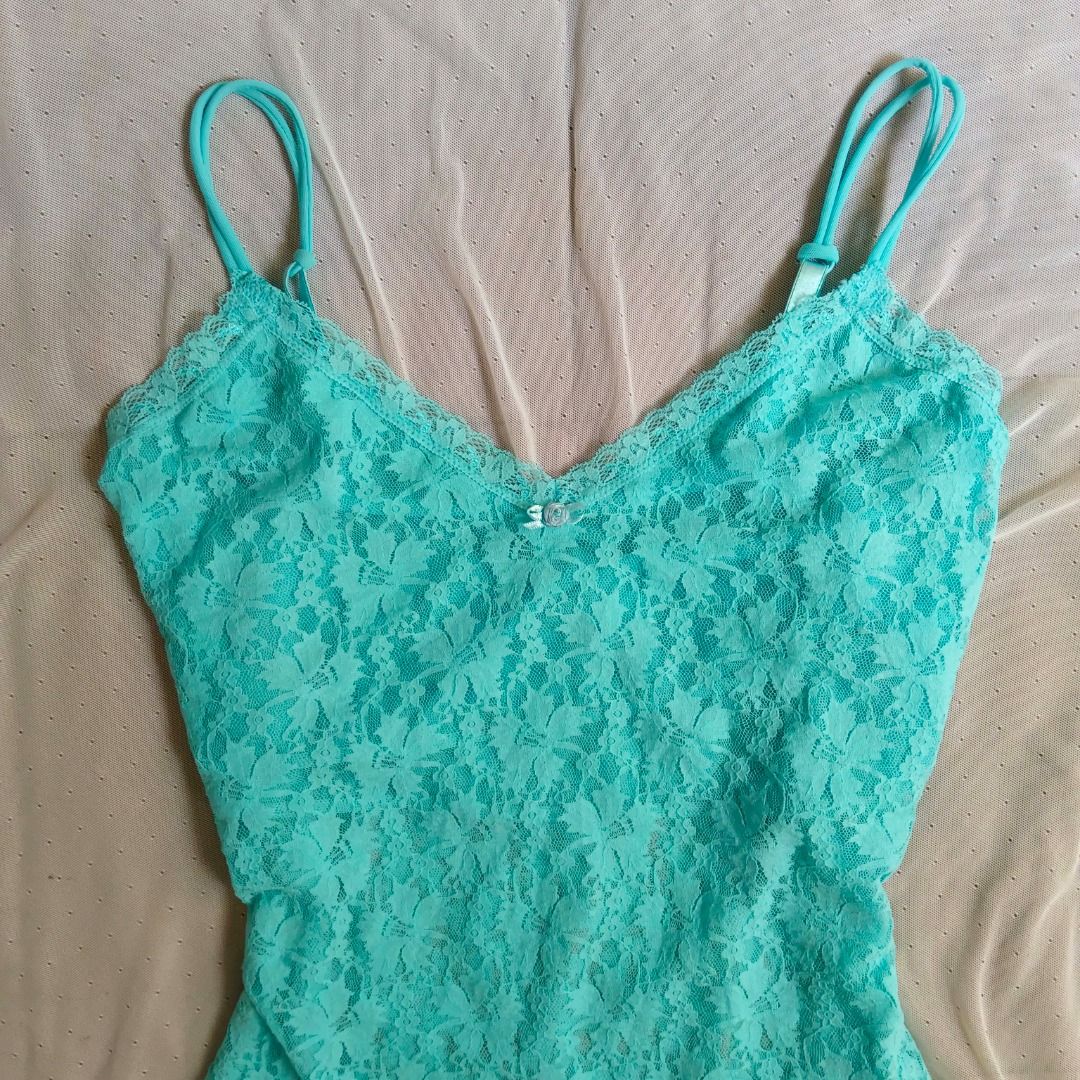 Teal Lace Camisole Tank Top (Category: Sleeveless) located in Manila. Submitted by electricpetals (Listing ID 1470704341, Image 2). Description: - Size: M-XL - Color: Teal/Bubblegum Blue - Straps: Adjustable thin straps for a custom fit - Detail: Cute small bow at the center bust - perfect for layering or wearing on its own - Condition: Excellent .