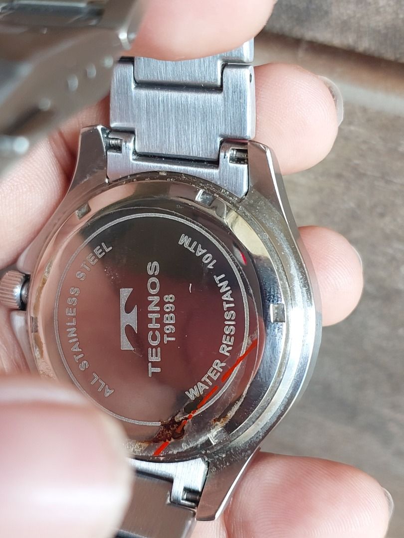Technos T9B98 Stainless Steel Diver Watch (Category: Men's Watches) located in Batangas. Submitted by vintageanddainty (Listing ID 1470581263, Image 3). Description: - Brand/Model: Technos T9B98 Dive Watch - Movement: Battery-powered quartz movement, keeping great time - Dial: Textured grey-blue with wave pattern, silver hands, and date window at 3 o'clock - Bezel: Dark blue rotating bezel with contrasting markers - Build: Stainless steel case an